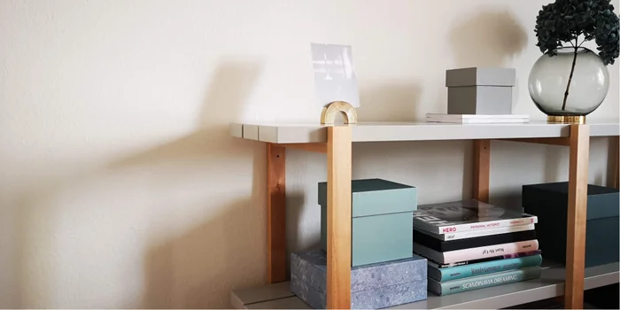 Storage boxes that match in color give a clean, uncluttered look to open spaces.