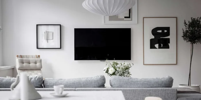There are many ways to elegantly integrate a TV into your home, for example with a photo mosaic. Photo: bjurfors.se There are many ways to elegantly integrate a TV into your home, for example with a photo mosaic. Photo: bjurfors.se