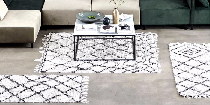 Skilful statement making: A rug will emphasize your end table styling. Picture: House Doctor